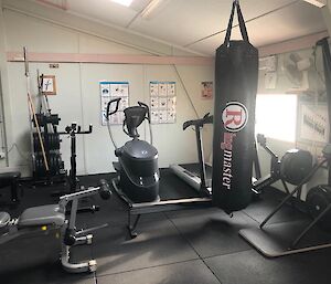 The station gymnasium showing the boxing bag, rower, treadmill and elliptical machine