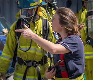 Woman talking to man in breathing apparatus