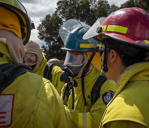 People in protective clothing and breathing apparatus