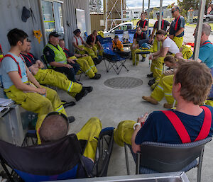 Group of people sit and talk