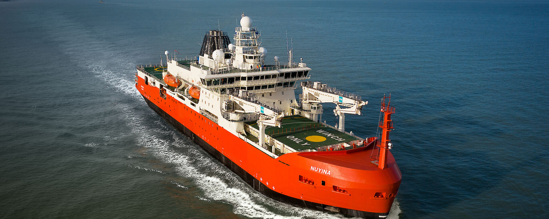 A red, white and black ice breaking ship