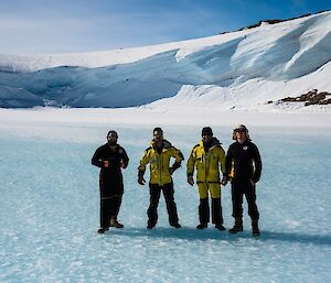 A crew of expeditioners standing on the sea ice