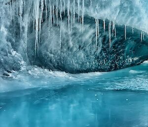 Ice cave with icicles on the roof.