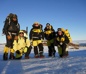 expeditioners in Antarctic gear on ice