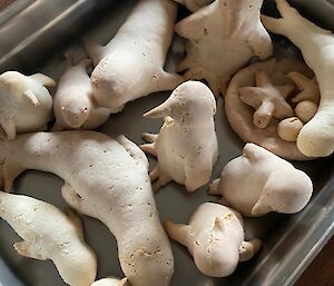 Various Antarctic animals in a baking tray moulded out of dough