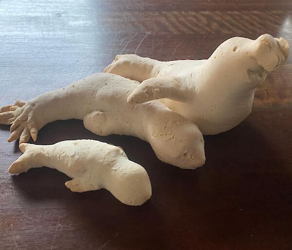 A father, mother and baby elephant seal made out of gingerbread dough