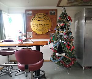 A work room in the station with the christmas tree up.