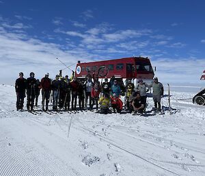 Group photo of expeditioners. Terrabus in the background.