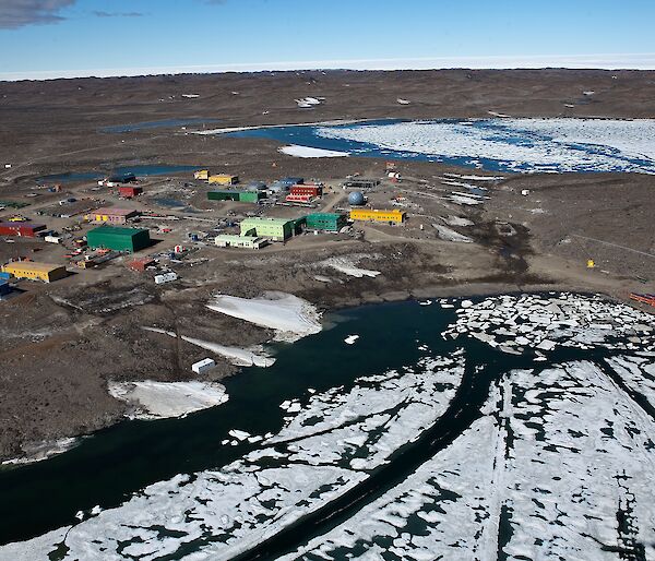 coloured buildings on rock, ice and water