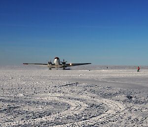 plane lands on snow runway