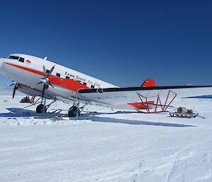 A Basler aircraft sitting on the ice runway