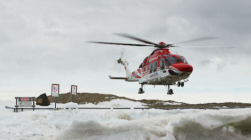 helicopter landing on snow