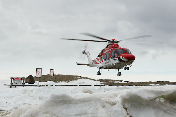 helicopter landing on snow