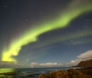 A bright green Aurora in the night sky