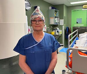 nurse stands in doorway of operating theatre