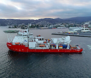 aerial view of ship leaving dock