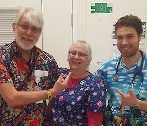 doctors and nurse wearing bright Hawaiian-style shirts