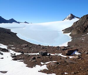 View looking down on a frozen lake