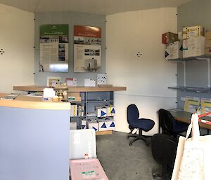 A reception desk and other post office paraphenalia inside the post office