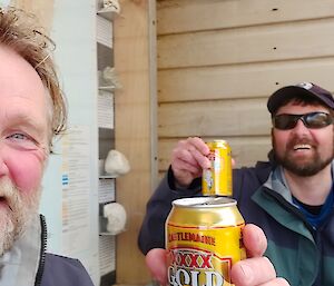 Mal and Arvid share a beer back on station, smiling to camera