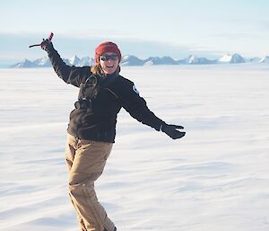 Woman posing in snow in Antarctica