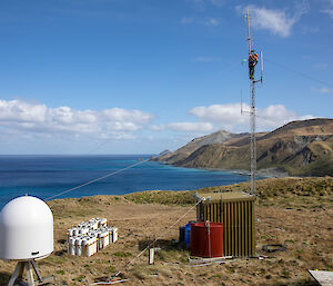 An antenna with Macquarie Island scenery in the background
