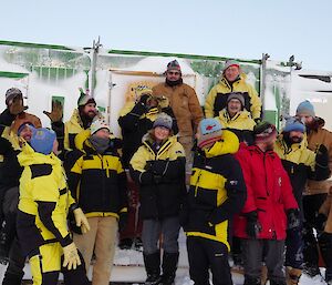 Group of expeditioners outside wearing beanies