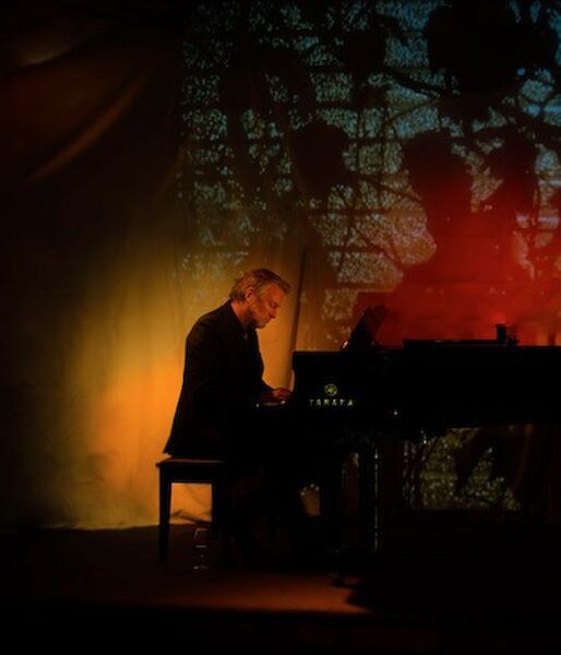 Man playing a grand piano