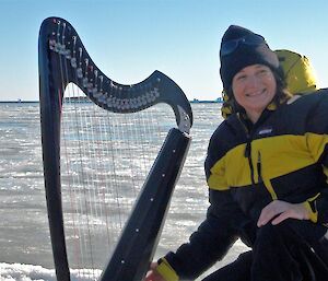Woman with harp on sea ice