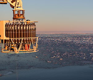Oceanographic equipment is lowered into icy ocean
