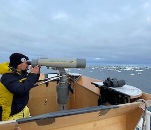 Scientist with large bionoculars