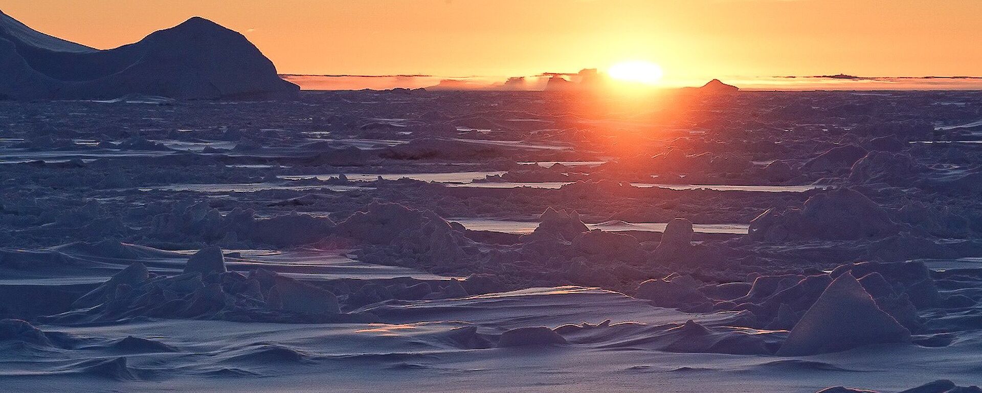 Sun setting over the ice