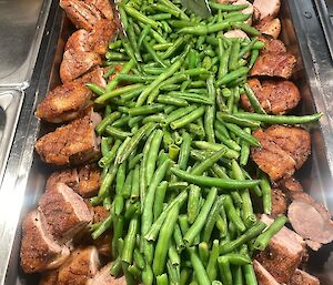 A platter of duck breast and green beans