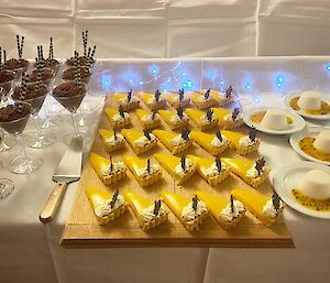 A dessert table featuring three different dishes