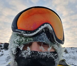 A man with all his face coverings frozen