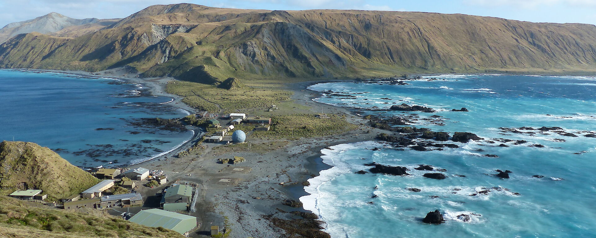 View of Macquarie Island station and the isthmus from a hill.