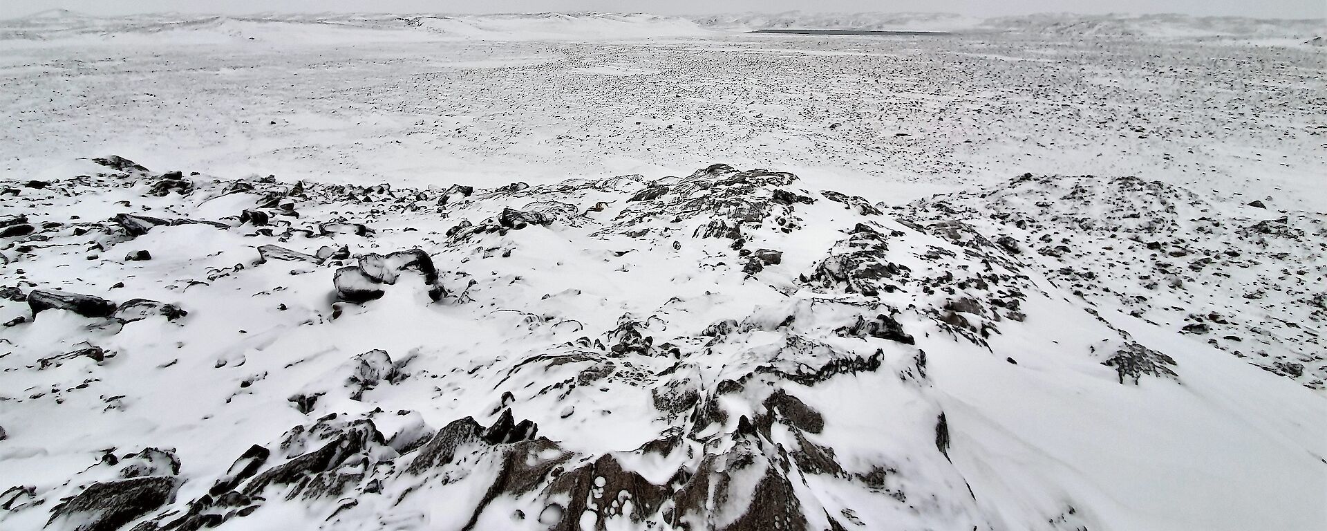 a rocky landscape covered in snow