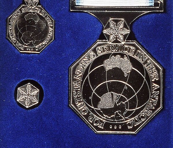 Australian Antarctic Medal sitting in a blue velvet box