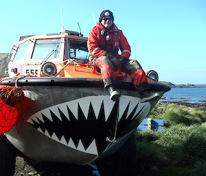 Man sitting on LARC with teeth painted on the bow