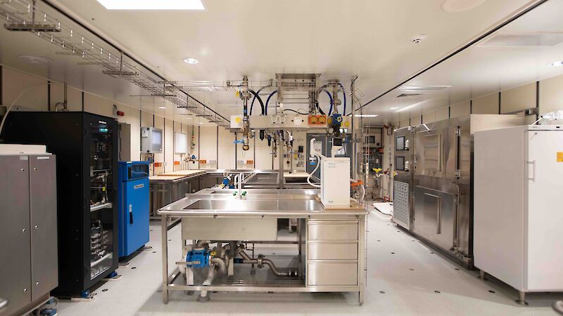 A marine laboratory with sinks,benches, storage cupboards and scientific equipment.