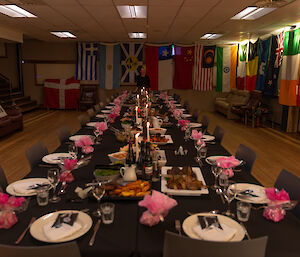 A table set for a feast with the chef at the far end