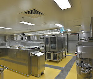 Stainless steel benches and appliances in Nuyina's kitchen.