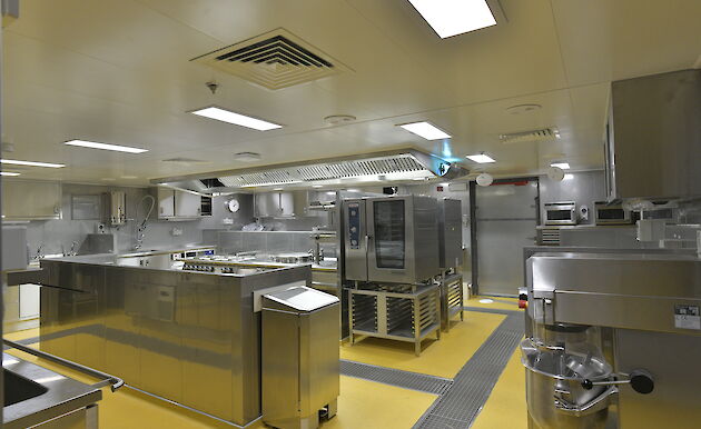 Stainless steel benches and appliances in Nuyina's kitchen.