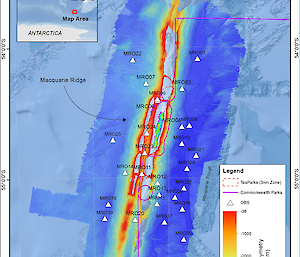 A graphic shows the location of the 27 ocean bottom seismometers deployed on the Macquarie Ridge Complex surrounding the island. Five seismometers were also evenly spaced along the length of the island. Dashed red lines indicate the Tasmanian Macquarie Island Nature Reserve–Marine Area (3-nautical-mile zone), and solid pink lines indicate the Commonwealth of Australia’s Macquarie Island Marine Park. MBES = multibeam echo sounding.