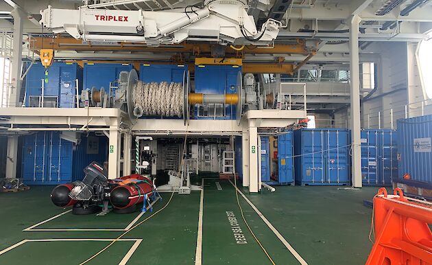 Blue shipping containers loaded in the Icebreaker's science deck