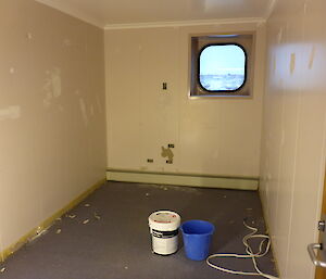 Photo of a room after being gutted of all furniture and fittings.