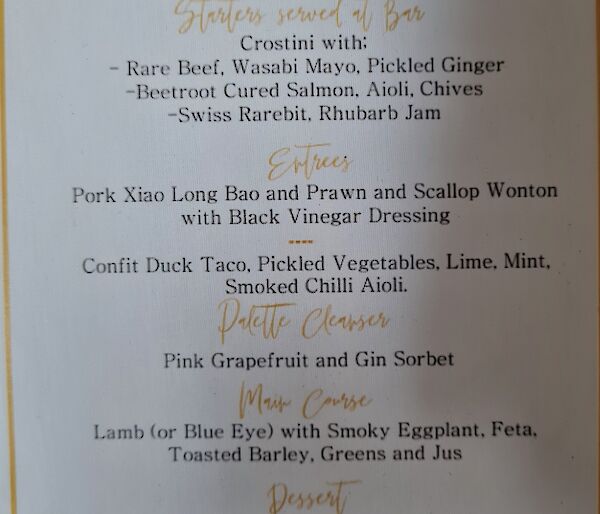 A fancy menu to celebrate midwinter detailing starters, entree, palette cleanser, main course , dessert and cheese platter