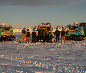 A group of people pose with three Haggs in front of the Sørsdal Glacier