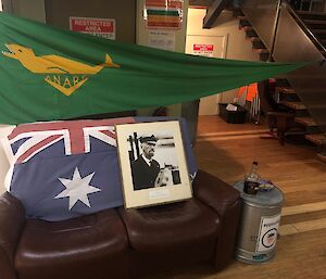 A seat decked out with an ANARE flag and a portrait of Capt Davis for midwinter 2021