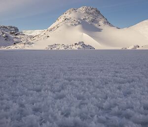 The ice crystal formations on the top of the lake's surface